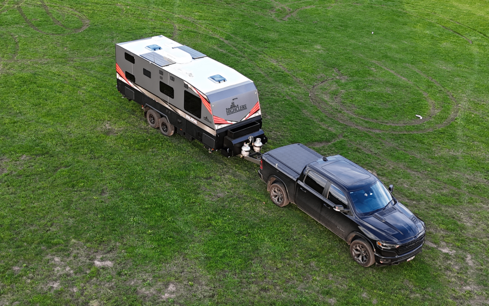 Highclere caravan towed across open ground